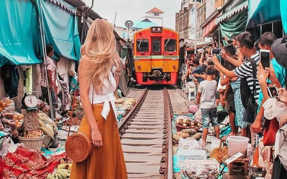 Capture the vibrant beauty of Mae Klong’s unique market